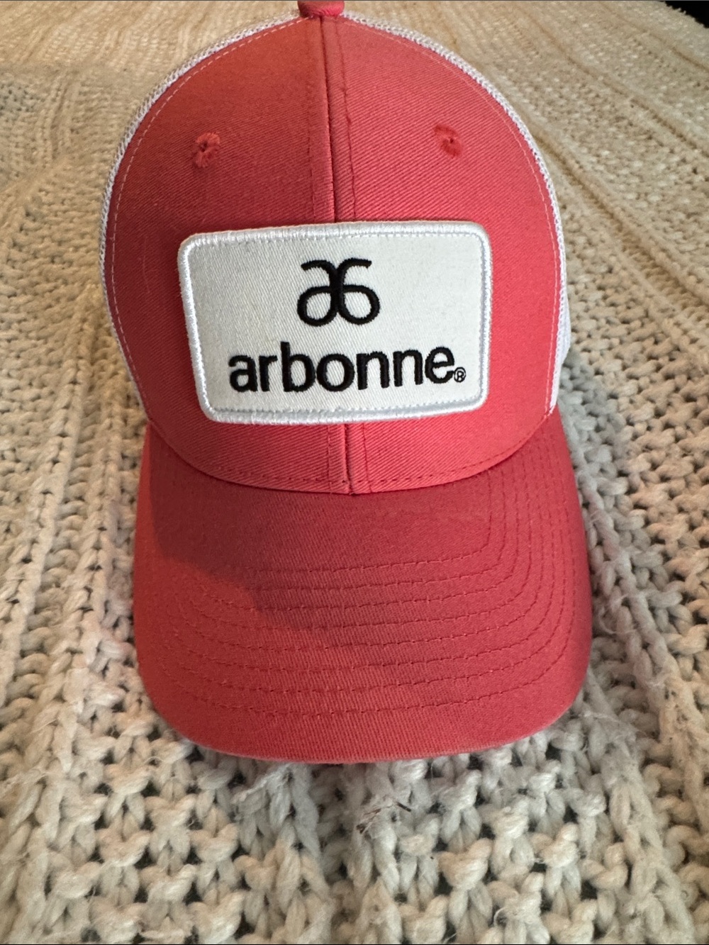 Arbonne Coral and White Logo Patch Trucker Cap